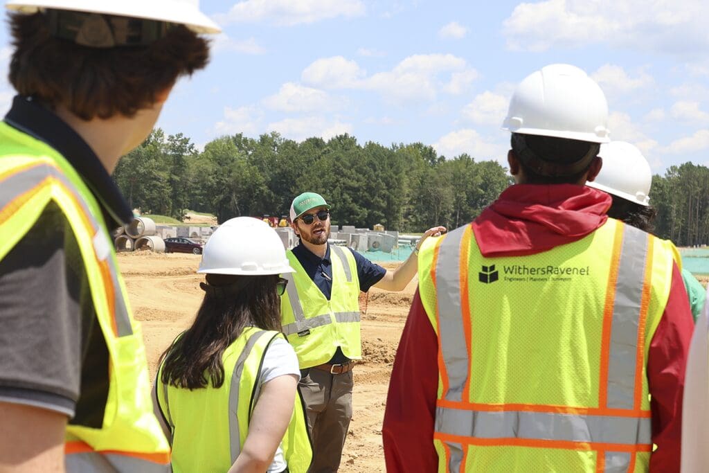 Interns learning at a project site.